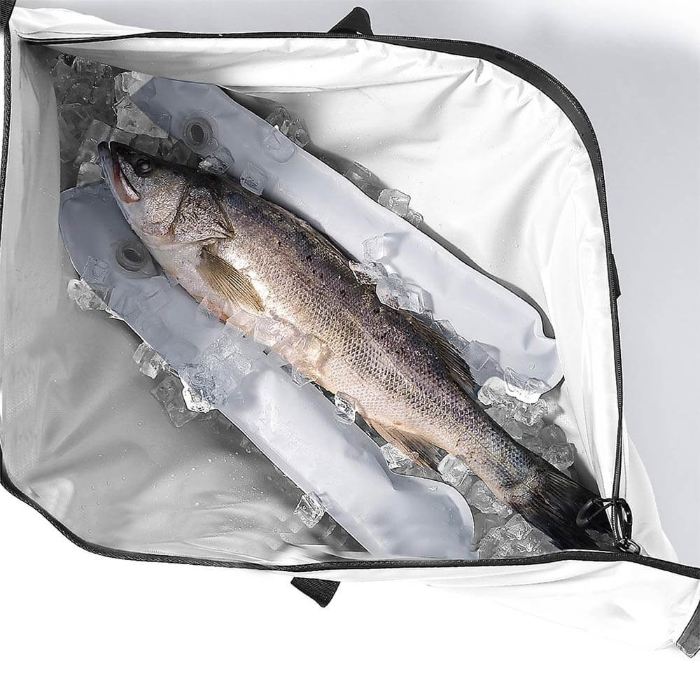 An open Buffalo Gear fish cooler bag containing fish and ice packs, against a white background.