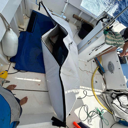 Buffalo Gear Tuna Fish Cooler Bag on a boat with various equipment around